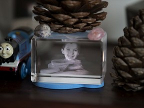 A hologram image of Geo Mounsef, 2, sits beside one of his toys on a bookcase at his grandparents' home, in Edmonton on Thursday, June 29, 2018. Geo was killed on May 19, 2013 when a car driven by Richard Suter crashed into the restaurant patio where Geo and his family were eating.