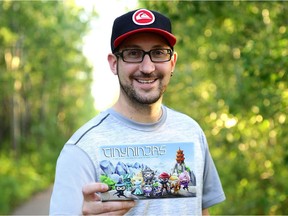 Ryan Leininger, 33, poses with his Tiny Ninjas board game, which was successfully funded on the online crowdfunding site Kickstarter.