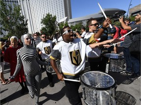 LAS VEGAS, NV - MAY 30: Cast members from "O by Cirque du Soleil" perform with the Vegas Golden Knights Knight Line Drumbots during The March to the Fortress at Toshiba Plaza before Game Two of the 2018 NHL Stanley Cup Final between the Golden Knights and the Washington Capitals at T-Mobile Arena on May 30, 2018 in Las Vegas, Nevada. The Capitals defeated the Golden Knights 3-2.