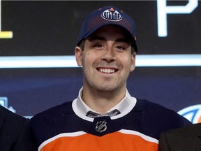 DALLAS, TX - JUNE 22:  Evan Bouchard poses after being selected tenth overall by the Edmonton Oilers during the first round of the 2018 NHL Draft at American Airlines Center on June 22, 2018 in Dallas, Texas.