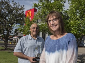 McDonald's franchise owners Hanif and Kristen Adatia outside their main location in Sherwood Park. The duo received the Golden Arch Award, the corporation's highest honour.