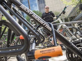 Edmonton Police Const. Daniel Tallack, from the Whyte Avenue Beats reminds cyclists to lock their bikes and use a good quality lock on June 8, 2018. Police has recorded almost 600 bikes being stolen so far in 2018.