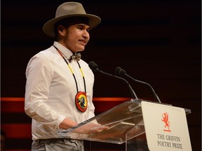 Edmonton poet Billy-Ray Belcourt accepting the Griffin Prize in Toronto earlier this month.