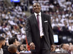 In this April 17 file photo, Toronto Raptors head coach Dwane Casey smiles against the Washington Wizards.