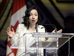 Bloc Quebecois Leader Martine Ouellet jokes during her speech at the Parliamentary Press Gallery Dinner at the Museum of History in Gatineau, Quebec on Saturday, May 26, 2018. Ouellet announced she is stepping down as head of the Bloc Quebecois after a resounding defeat in a weekend leadership vote.