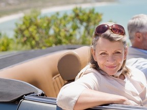 Older couple in a convertible.