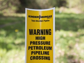 A sign where buried pipelines are located is seen in Burnaby B.C., just outside the Kinder Morgan location.