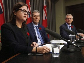 Manitoba Premier Brian Pallister (C) and Growth, Enterprise and Trade Minister Blaine Pedersen (R) listen in as Justice Minister Heather Stefanson talks about the Manitoba plan for cannabis retail and distribution at the Manitoba Legislature in Winnipeg, Tuesday, November 7, 2017.Manitoba's Progressive Conservative government said Wednesday it has the right to ban home-grown cannabis, and will defend the idea in court of the federal government tries to force the province to allow home-cultivated weed.
