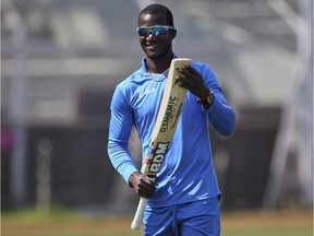 West Indies' captain Darren Sammy checks his bat during a practice session ahead of their ICC Twenty20 2016 Cricket World Cup semi final match against India in Mumbai, India, Tuesday, March 29, 2016. West Indies cricket star Darren Sammy says he has no problem playing with disgraced former Australia skipper Steve Smith in the Global T20 Canada tournament.
