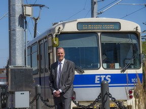 Dave Beckley, vice-president of commercial operations and customer service for Thales Canada, stands near signals his company installed on the Metro Line near 105 Street.