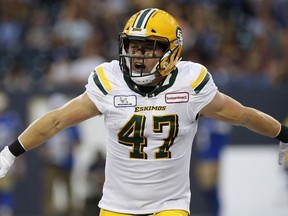 Edmonton Eskimos' JC Sherritt (47) celebrates his fumble recovery against the Winnipeg Blue Bombers during the first half of CFL action in Winnipeg Thursday, June 14, 2018.