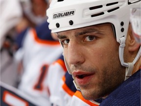 Milan Lucic of the Edmonton Oilers looks  on from the bench against the Calgary Flames at Scotiabank Saddledome on Dec. 2, 2017 in Calgary.