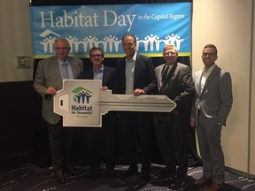 From left Habitat for Humanity Edmonton president and CEO Alfred Nikolai, Coventry Homes president and CEO Henri Rodier, Sterling Homes vice-president Zan Owsley, MLA Lorne Dach and board chair Ian MacDonald following the Habitat Day in the Capital Region announcement of two local homes being donated to the organization.