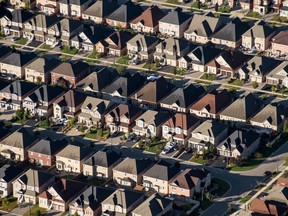 Homes stand in this aerial photograph taken above Toronto, Ontario, Canada, on Monday, Oct. 2, 2017. Toronto housing prices fell for a fourth month in September as sales remained sluggish, particularly in the detached-home segment that has borne the brunt of the correction in Canada's biggest city. Photographer: James MacDonald/Bloomberg ORG XMIT: 775055524