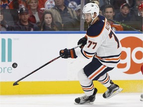 Edmonton's Oscar Klefbom trys to settle the puck down during the second period of a preseason NHL game between the Edmonton Oilers and the Carolina Hurricanes at Rogers Place in Edmonton on Monday, Sept. 25, 2017.