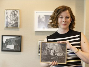 Coun. Sarah Hamilton holds a historic photo of a location in her ward in her city hall office. The region's roots to the fur trade still resonate, she says.