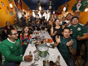 Mexico supporters cheer while watching the Mexico-Germany World Cup game at The Three Amigos restaurant in Edmonton, on Sunday, June 17, 2018. The restaurant is open for all World Cup games.