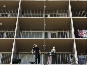 Cayman Alexander and Emily Thomas woke to a shirtless man scaling the outside of the apartment building at 10711 Capital Blvd. overlooking Saskatchewan Drive in Edmonton on Sunday, June 17, 2018. The man was arrested by police.