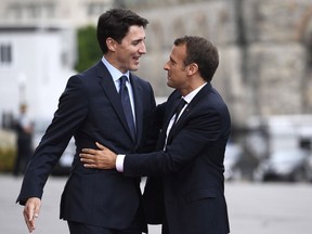 Prime Minister Justin Trudeau greets President of France Emmanuel Macron as he arrives on Parliament Hill during a visit in Ottawa on Wednesday, June 6, 2018.