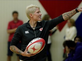 Retired rugby player Jennifer "Jen" Kish talks with students at W.P. Wagner High School in Edmonton on June 6, 2018. An event was held at the school to recognize the achievements of the former Canadian rugby sevens captain and Edmonton Olympian. Kish first started playing rugby while attending the high school. The City of Edmonton proclaimed June 7, 2018 as Jen Kish Day in the city. (PHOTO BY LARRY WONG/POSTMEDIA)