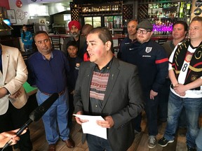Edmonton-Ellerslie NDP MLA Rod Loyola announces Alberta will implement a blanket early sales exemption for all liquor licensees during the FIFA World Cup on Tuesday, June 12, 2018 at Jack's Pizza Cafe in south Edmonton. Loyola was joined by soccer fans and cafe owner Deep Gill, left.