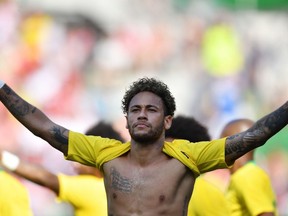 Brazil's Neymar celebrates during the international friendly footbal match Austria vs Brazil in Vienna, on June 10, 2018.