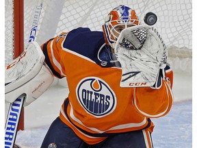 Edmonton Oilers goalie Cam Talbot makes a save during first period NHL game action against the Vancouver Canucks in Edmonton on Jan. 20, 2018.