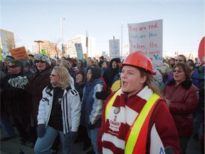 A photo from Feb. 21, 2002, shows Edmonton Public Schools elementary teacher Heather Johnson wearing a hard hat in the crowd with 500 teachers who picketed the Edmonton Public school board office in the third week of a strike.