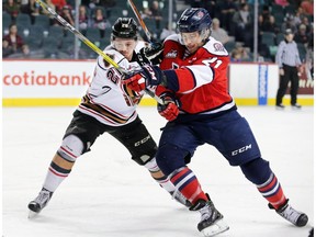 Lethbridge Hurricanes Ryan Vandervlis, right, in action during a Calgary Hitmen game at the Saddledome on Jan. 15, 2017.