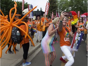 Premier Rachel Notely takes a selfie with Jen Kish, Olympic rugby medallist at the beginning of the Edmonton Pride parade on Saturday, June 9, 2018 . Greg  Southam / Postmedia