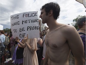 Protestors block the street and hold up the Edmonton Pride parade on Saturday, June 9, 2018 .