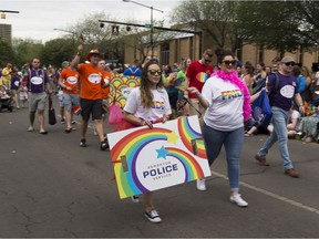 Participants take part in the Edmonton Pride parade on Saturday, June 9, 2018.