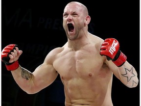 Edmonton's Victor Valimaki celebrates his win over Bill Widler during MFC 40 Crowned Kings at the Shaw Conference Centre, in Edmonton Alta., on Friday May 9, 2014.