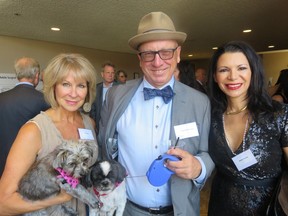 Getting ready to walk the red carpet with their pets at the Haute Dawg gala are Jill Didow, left, Greg Christenson and Karyn Decore.