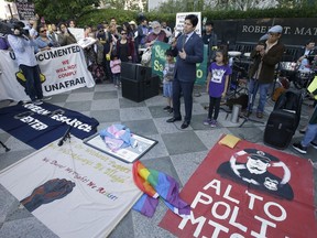 State Sen. Kevin de Leon, D-Los Angeles, speaks at demonstration outside the federal courthouse where a federal judge will hear arguments over the U.S. Justice Department's request to block three California laws that extend protections to people in the country illegally, Wednesday, June 20, 2018, in Sacramento, Calif. De Leon authored SB54, one of the laws before the court.