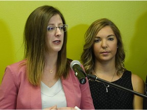 Elizabeth Halpin (right), a survivor of sexual violence, was joined by Stephanie McLean (left, Alberta minister of status of women) for the announcement of the Alberta government's new pilot program to help sexual violence survivors. The announcement was held at the Elizabeth Fry Society in Edmonton on Friday, June 15, 2018.