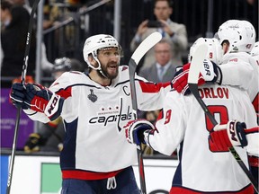 Washington Capitals left wing Alex Ovechkin, left, of Russia, celebrates a goal by right wing Tom Wilson,  during the third period in Game 1 of the NHL hockey Stanley Cup Finals Monday, May 28, 2018, in Las Vegas.