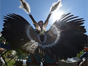 Dancer Dakota Ward prepares his feather bustle as Westglen School hosted the first annual Traditional PowWow presentation. A new National Indigenous Cultural Expo will include many different Indigenous cultural expressions at a three-day event in September.