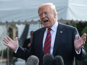 US President Donald Trump speaks to the press before departing the White House for the G7 summit in Washington, DC, on June 8, 2018.