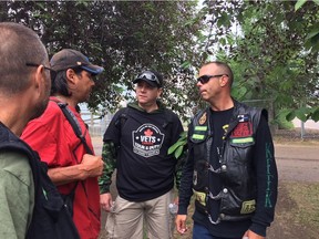 Volunteers with Veterans Emergency Transition Services Canada, including James McDiarmid, right, walk through Edmonton's inner city in search of homeless veterans.