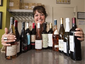 Juanita Roos with some of the 2018 dozen value wines for summer on Thursday, June 7, 2018 in Edmonton.