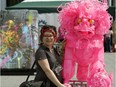 Christyna Rokicki checks out a piece of art work by artist Yong Fei Guan at The Works Art and Design Festival in downtown Edmonton on Monday June 25, 2018.