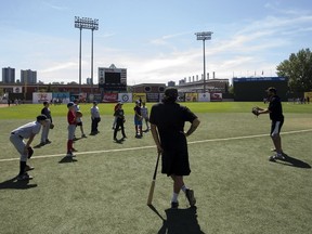 (left to right) Edmonton Prospects' Daylen Calicdan and Nick Spillman lead a kids instructional camp at Re/Max Field, in Edmonton Monday July 16, 2018.