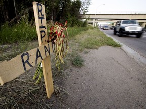A memorial is seen Tuesday, July 31, 2018, along west bound Yellowhead Trail near 124 Street following a July 27, 2018 fatal collision.