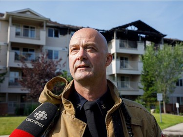 District Fire Chief Ed Pitman speaks at the scene of a fire in the Blue Quill neighbourhood in Edmonton on Sunday, July 29, 2018.