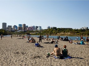 People enjoy a hot summer day on "Accidental Beach" in Edmonton on Tuesday, August 29, 2017.