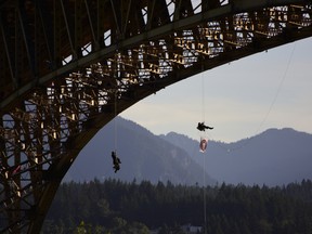 Anti-Trans Mountain protesters plan to rappel from Vancouver's Ironworkers Memorial bridge as part of an aerial blockade of oil tanker traffic on Tuesday morning.