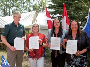 The Métis Nation of Alberta signed an agreement with Parks Canada to give its members free access to national parks and national historic sites in Alberta on Tuesday, July 31, 2018. At the announcement are Dave McDonough, acting executive director, Pacific and Mountain Parks, Parks Canada, left, Métis Nation of Alberta president Audrey Poitras, Métis Nation of Alberta co-minister of Métis rights and accommodation Bev New and Métis Nation of Alberta co-minister of Métis rights and accommodation Karen Collins.