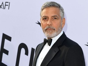 (FILES) In this file photo taken on June 07, 2018 US actor George Clooney attends the 46th American Film Institute Life Achievement Award Gala at the Dolby Theatre in Hollywood. YouTube Premium webcast has commissioned a dark humor comedy that will be co-produced by George Clooney and Kirsten Dunst, who will also be the lead performer, according to the specialized media on June 25, 2018