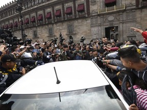 Mexican President-elect Andres Manuel Lopez Obrador (inside vehicle) arrives at the National Palace in Mexico City to hold a meeting with President Enrique Pena Nieto, on July 3, 2018 Mexican president-elect Andres Manuel Lopez Obrador meets his outgoing predecessor, Enrique Pena Nieto, to begin preparing the transition he promises will bring "profound change" to the country.